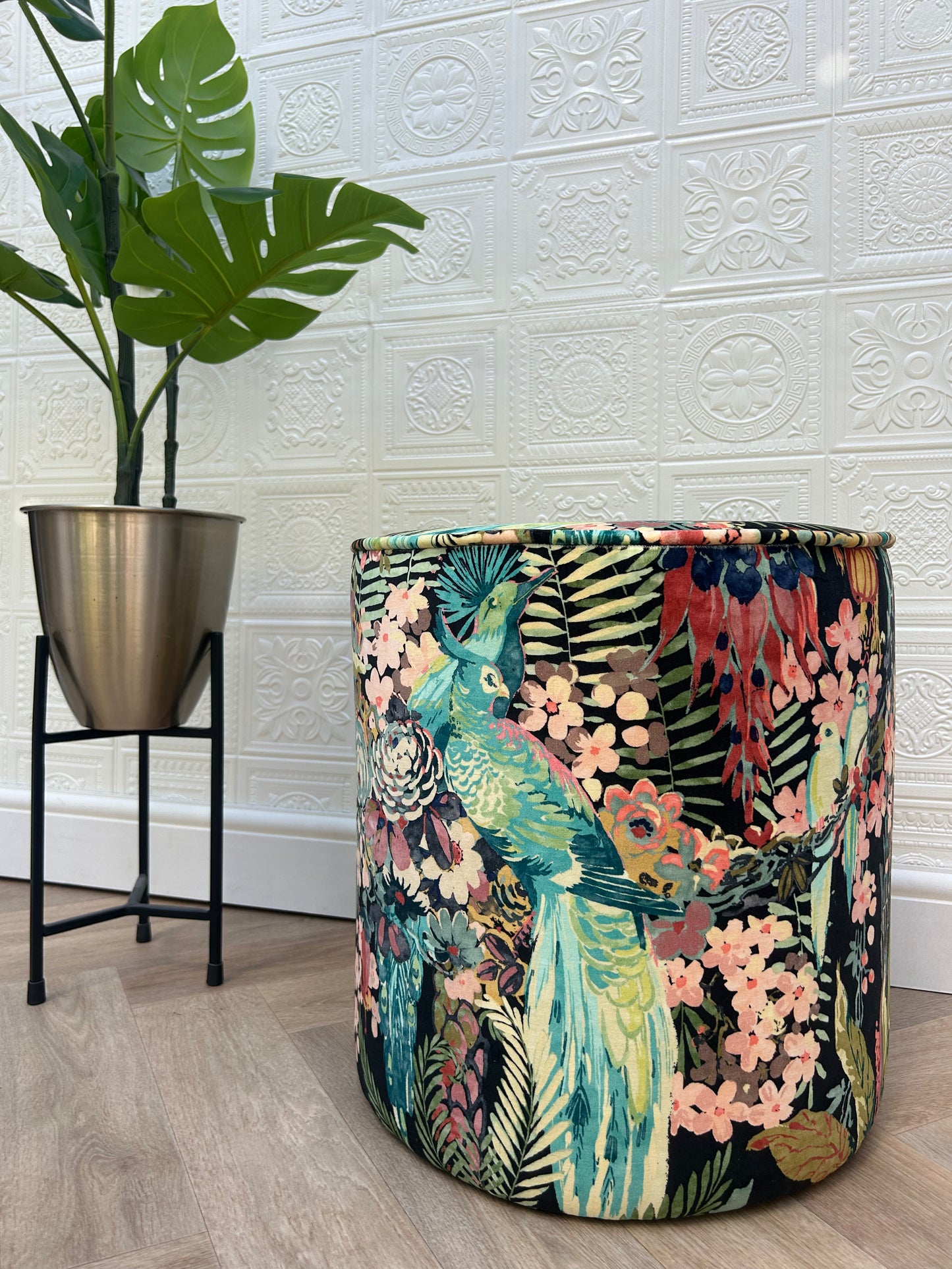 Decorative cylindrical container with floral and peacock design