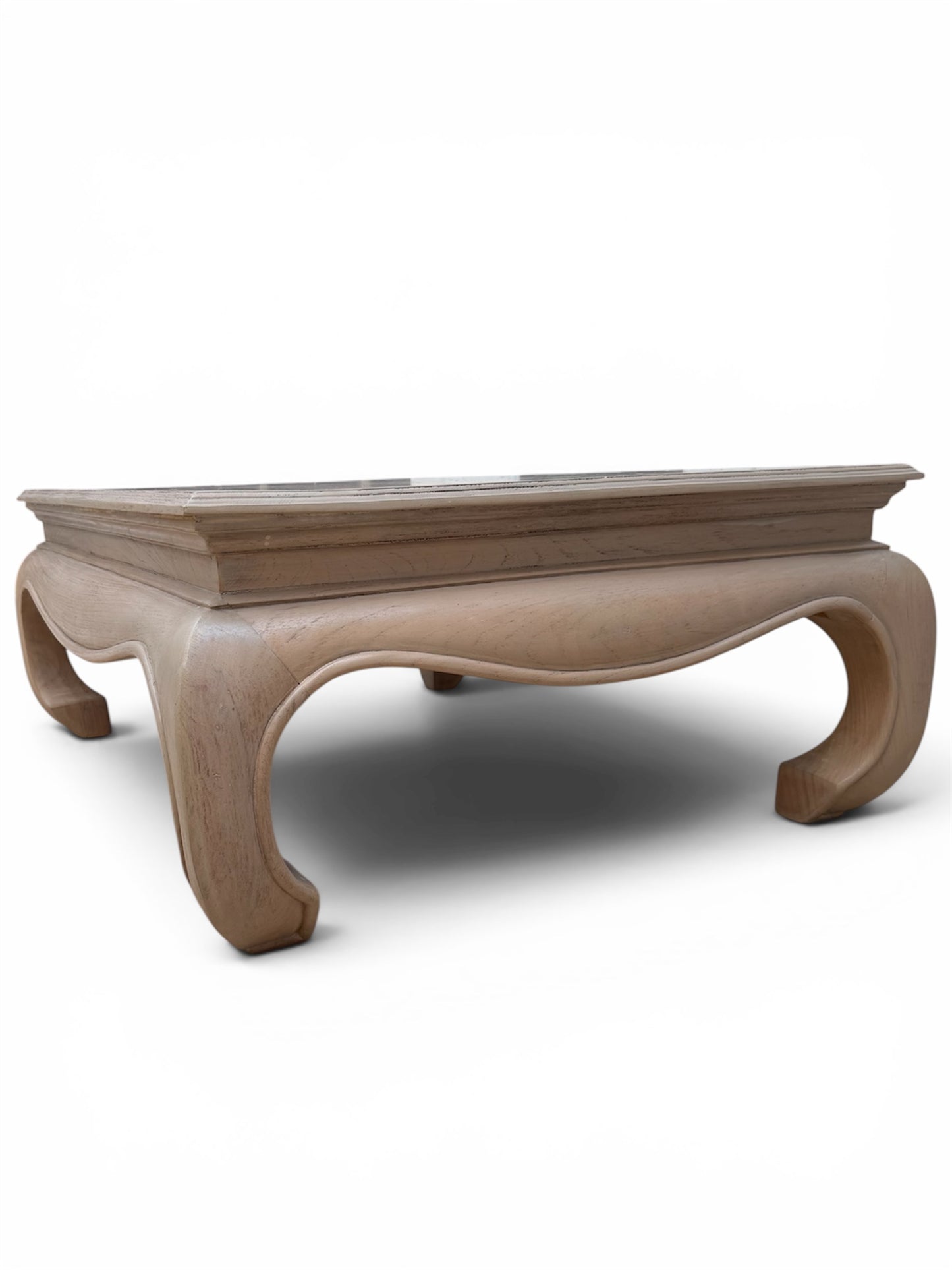A low profile wooden coffee table with a rectangular top and curved cabriole-style legs.