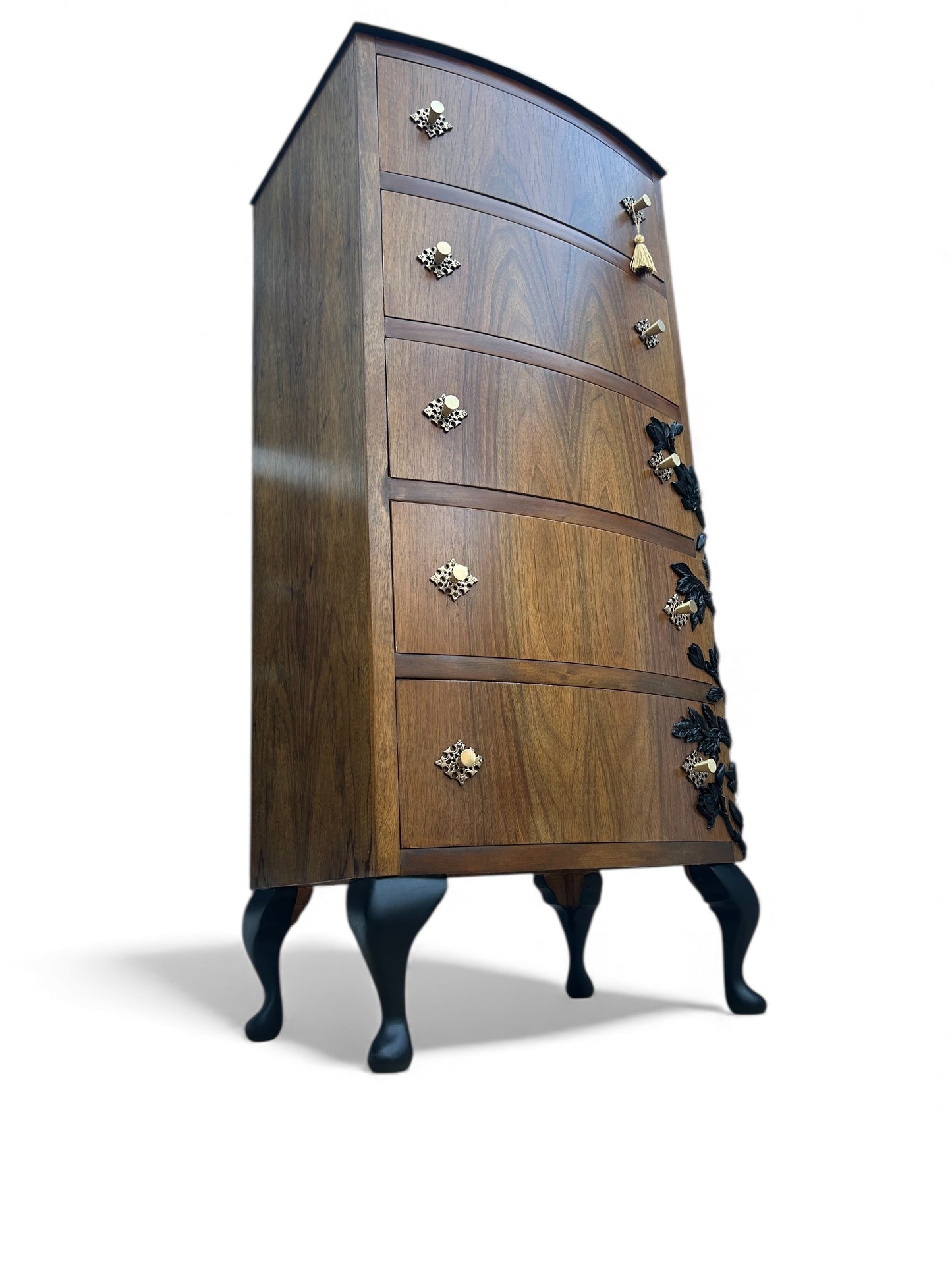 Wooden dresser with decorative legs and handles on a white background