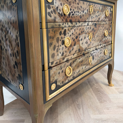Leopard print dresser with brass accents 