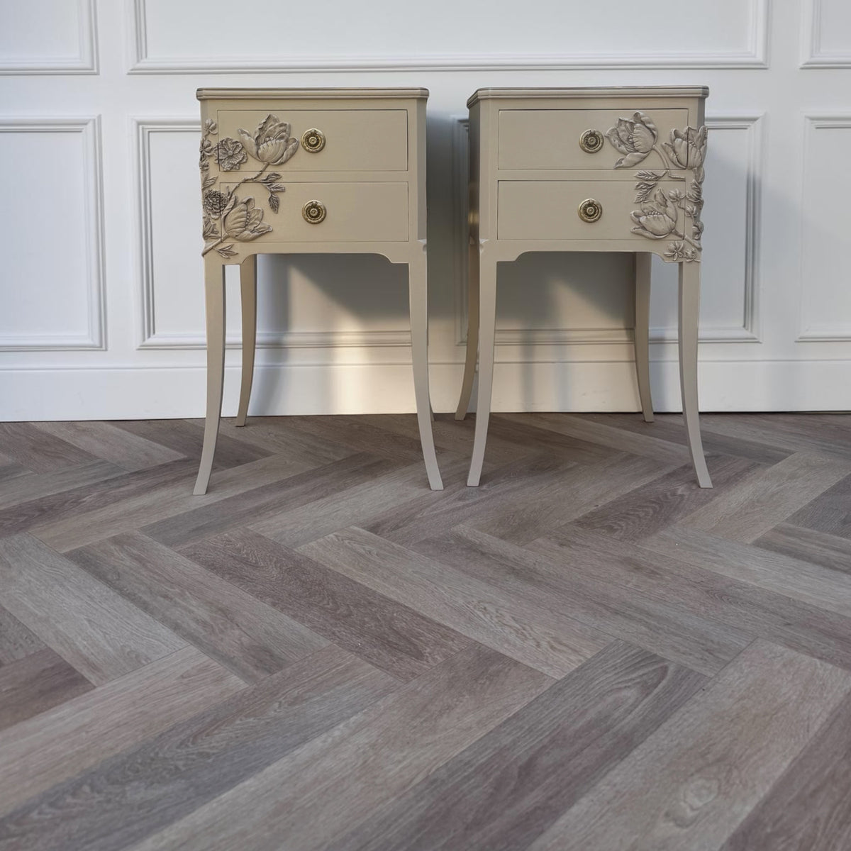 matching pair beige nightstands with floral details
