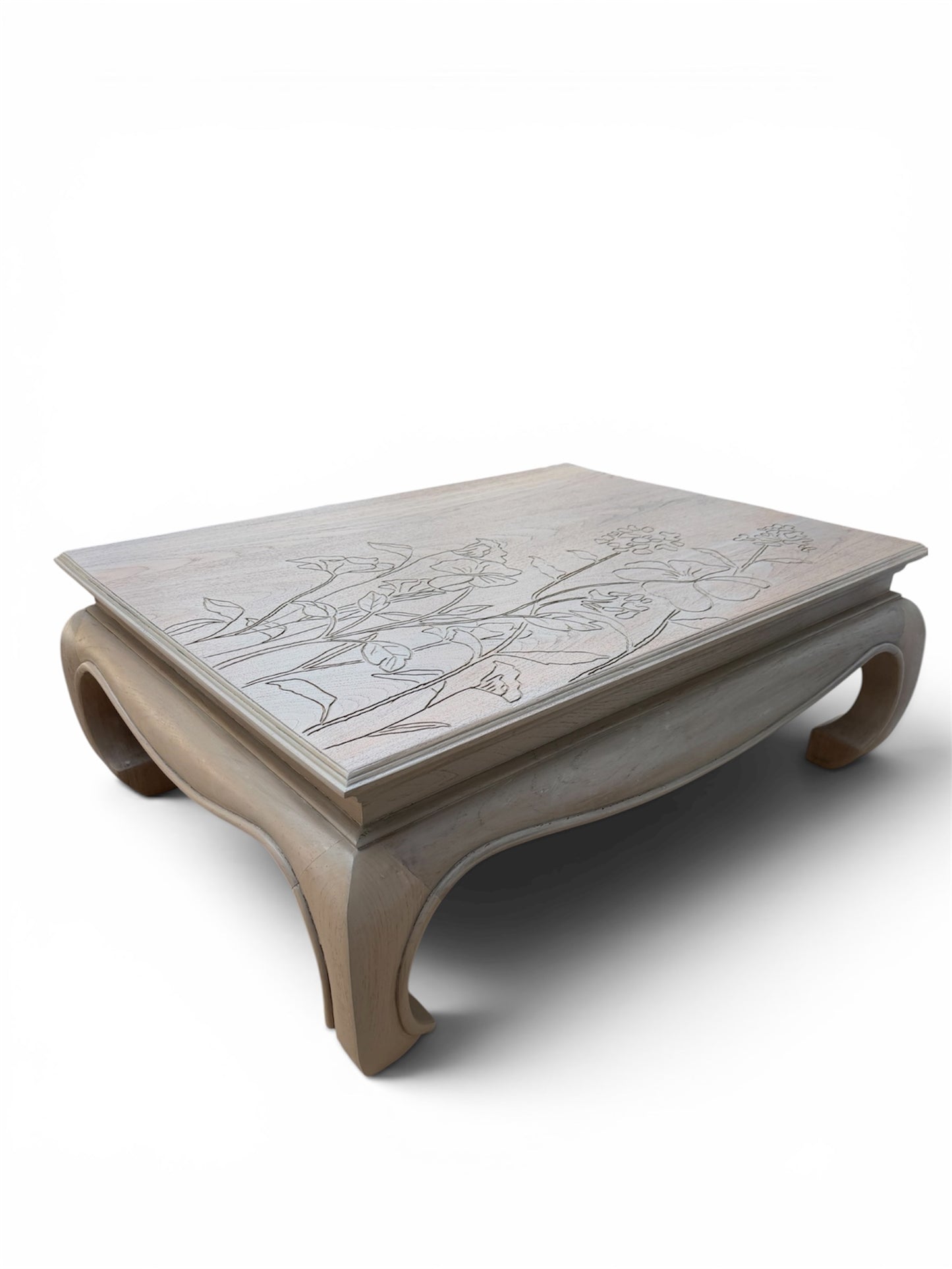 A square wooden coffee table with a carved floral pattern on the top, featuring curved legs and a light stain finish, shown on a white background.