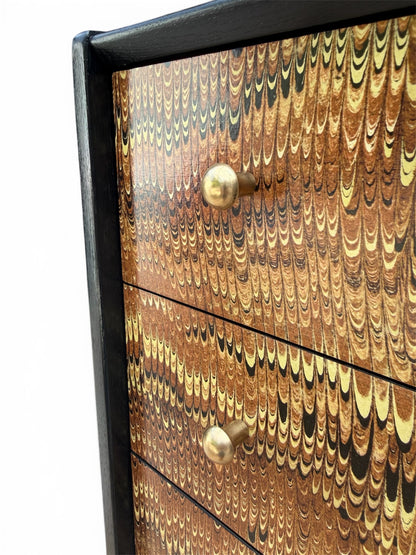 Gold Brass Hardware compliementing a rich marbled tones of browns