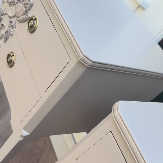 video of closeup of matching refinished vintage nightstands with artistic floral details
