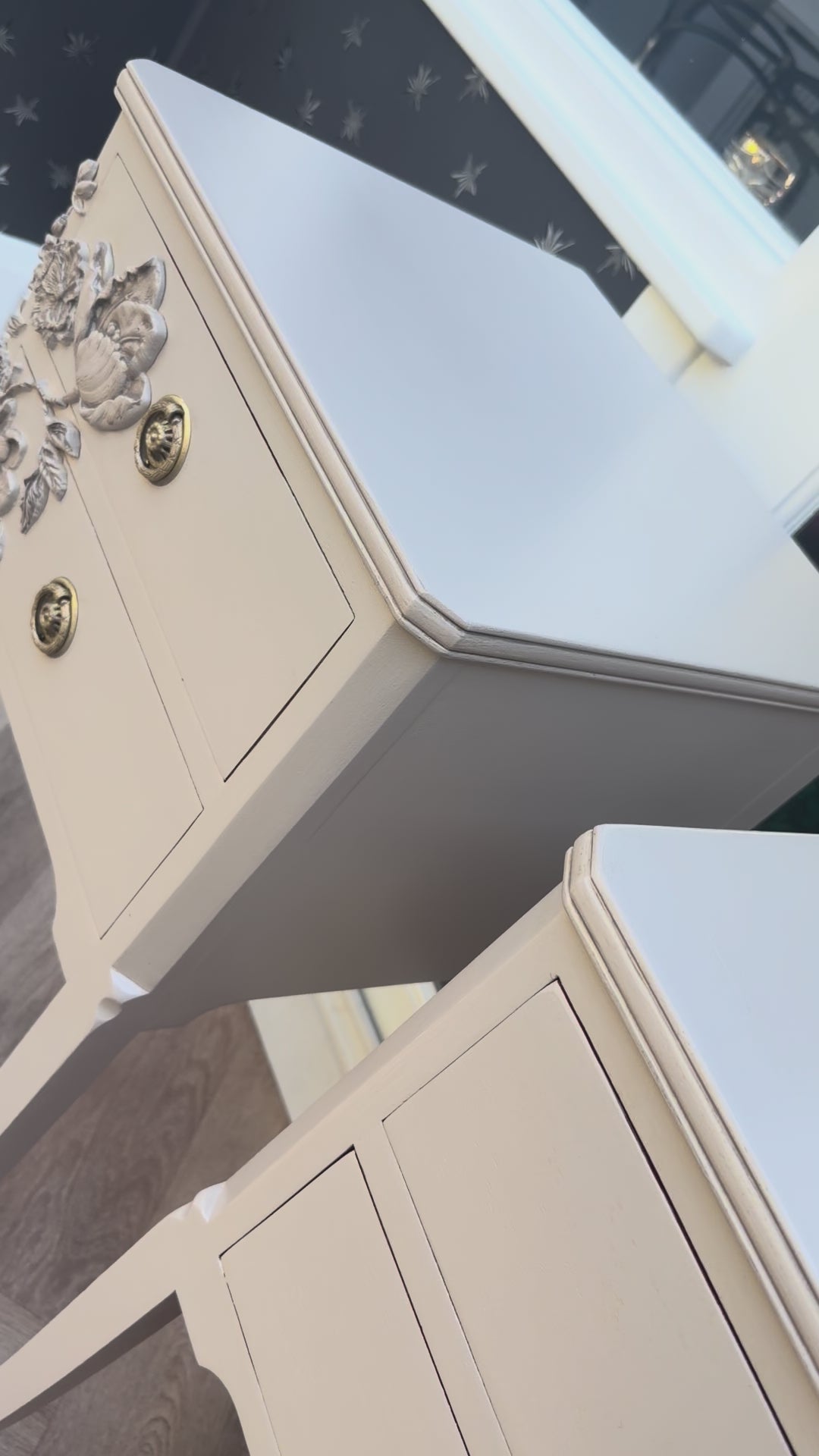 video of closeup of matching refinished vintage nightstands with artistic floral details